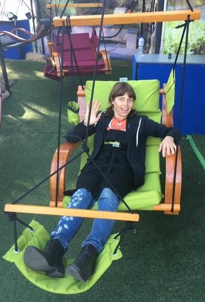 Karen relaxing in a hammock chair after talking at a garden question and answer at MIFGS