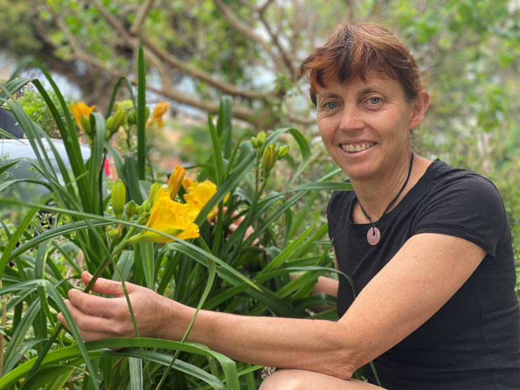 Karen Sutherland with edible day lily plant